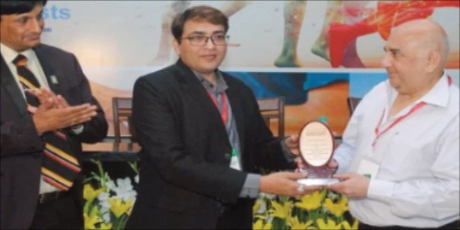 Trophy presentation at a physiotherapy conference